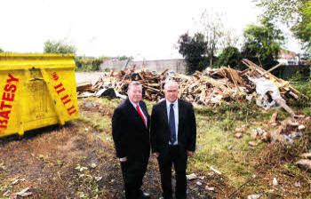 At Longstone Street in Lisburn where derelict properties have recently been demolished are Alderman Paul Porter, Chairman of the Lisburn Housing Executive Liaison Committee and Alderman James Tinsley, Chairman of Lisburn City Council's Planning Committee.