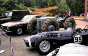 The replica of the Harry Ferguson aeroplane was the backdrop to a unique gathering of Ferguson designed and inspired vehicles. (L to R) Jensen FF Grand Tourer, 4WD `Wee Grey Fergy' Tractor and the P99 Formula 1 racing car.