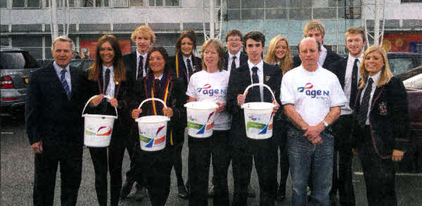Councillor Brian Bloomfield with Age NI volunteer Alan Madill, Age NI marketing assistant Dorothy McConkey and upper sixth pupils from Wallace High School at the recent bag pack.
