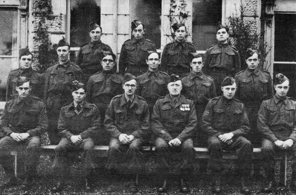 The Home Guard photo, which is believed to have been taken somewhere in Hillsborough. Back row: All unknown. Middle row: Unknown except last on right who is one of the Rutherford brothers who ran a grocers shop in Market Square, Lisburn, up until the 1970s. Front row: Second from left is the second Rutherford brother. Raymond believes the third from left is _ Maginnis (first name unknown) who was a solicitor and an MP in the Stormont Parliament at some stage. Second from right is Raymond's father Sgt James Munce Morrison.