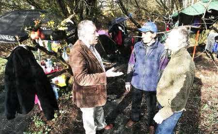 Cllr Pat Catney with Zenon and Maciej in the woods where they are living. US0912-117A0