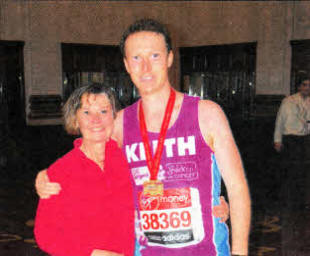 Keith with his mum Janet at the end of the London Marathon.