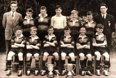 Members of the Lambeg Primary School football team who won the league cup in 1955 were William Shanks, John Neill, John McCormac, Jack Kennedy, with the League for the new season the principal Mr Tommy Priestley. Front row Kenneth McCabe, Jim Bain, Mervyn Law, Will Hunter, Jim Houston and Albert Ward. Looking on is teacher Mr Val Gough
