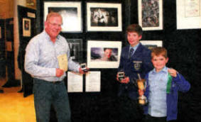 Lisburn's Ross McKelvie left with his sons Michael and James at the NIPA exhibition.