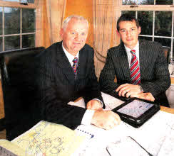 Ken Cleland, managing director of Arborhill Ltd, and his son Peter Cleland, project manager with the company, reviewing plans for a new hotel to be built at Hillsborough Road. USO412-516cd Picture: Cliff Donaldson