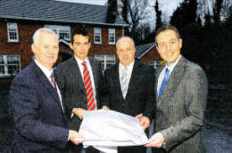Ken Cleland, managing director of Arborhill Ltd, his son Peter Cleland, project manager with the company, Alderman James Tinsley, chair of planning at Lisburn City Council, and Paul Givan MLA, pictured outside Mr Cleland's home on the Hillsborough Road, Lisburn, which is to become the site for a new hotel. US0412-517cd