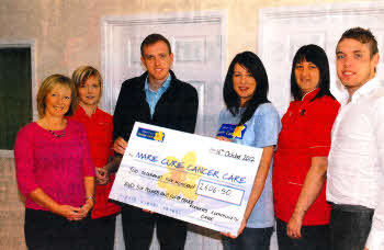 Staff from Rodgers Community Care hand over a cheque for £2606.50 to Marie Curie Cancer Care represented by Ruth Hope. The money was raised at the charity's Walk 10 event held at Stormont. Included are Adele Faloon, Jeana Sanderson, Michael Rodgers, Sue-Ellen Lovell and Gary Rodgers. INUS42-RODGERS
