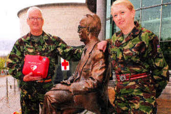At the statue of the late eminent Professor Frank Pantridge, the former Royal Army Medical Corps doctor who invented the original defibrillator, are 204's Commanding Officer, Colonel Alan Black, (holding the latest version of the defibrillator) and Senior Nursing Officer, Lieutenant Colonel Joy McGrath.