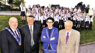 John D'Arcy with Deputy Mayor William Leathern, Harmony Hill PS Principal Harry Greer, and Chairman of Lisburn Arts Advisory Committee David Sloan with the pupils in the background. US1912-403PM Pic by Paul Murphy