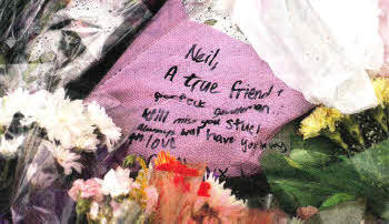 Flowers left at Woodland Park where Neil Graham, 24, was killed when his motorcycle was in collision with a car.