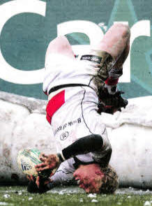 'Explosive and committed', Nevin lands on his head as he scores a famous try against Bath In the Heineken Cup at the Recreation Grounds, Bath in December 2010. Picture by Matt Mackey/Presseye.com.