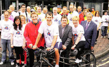 Olympic hockey gold medallist Jimmy Kirkwood, Health Minister Edwin Poots, Jeffrey Donaldson MP, world champion water skier Janet Gray and ClIr Uel Mackin pictured at Lagan Valley Hospital with cyclists taking part in a cycle ride to raise funds for NI Transplant Forum.