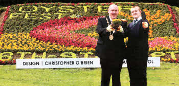 The Mayor of Lisburn William Leathern and the winner of the flowerbed competition Christopher O'Brien.
