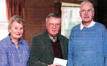 Violet Swarbrigg Secretary, Jim Henry Chairman and Stephen Anderson Treasurer Parkinsons UK Lisburn Branch making a donation of £6000 to Professor Duchen of the University 0f London Parkinson's Research Project. 050312-101A
