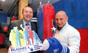 Hughes Insurance Lisburn Branch Manager Andrew Oliver with Patrick McKay