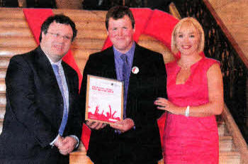 With Employment and Learning Minister Dr. Stephen Farry are television presenter Tina Campbell and Philip Green, shortlistee for VQ Learner of the Year 2012.