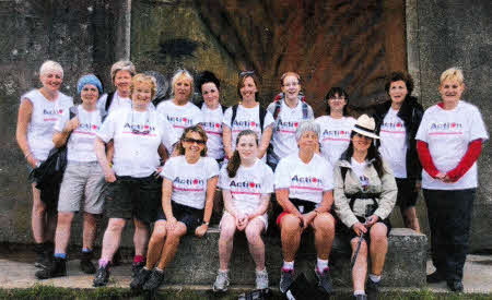 Schoolgirl Anna Armstrong (centre, seated) with her mum Jackie (front row left, standing) and their fellow Action Cancer Camino de Santiago trekkers 