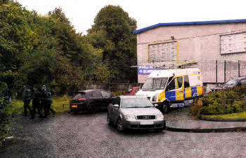 Police prepare to search the former World of Furniture site.