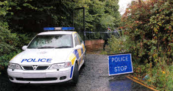 Police prepare to search the former World of Furniture site