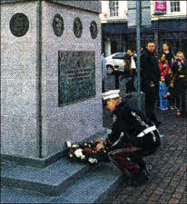 Members of Pride of Knockmore Flute Band lay a wreath at the UDR memorial at Market Square. US2012.504cd