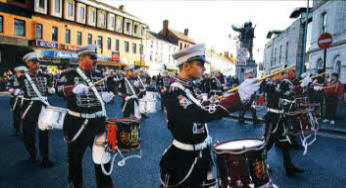 Members of Pride of Knockmore Flute Band march through Market Square after laying a wreath at the UDR memorial during Friday evening's band parade through Lisburn. US2012.505cd
