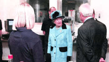 The Queen touring the Coca Cola plant at Knockmore hill In October 2010