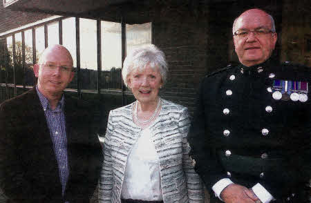 Lord Lieutenant of County Antrim Joan Christie OBE poses with Royal Irish Regiment Bandmaster Chris Attrill and Wallace High School Vice Principal David Cleland prior to a fundraising concert for ABF The Soldiers' Charity.
