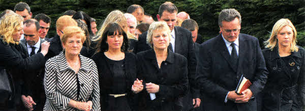From left, Yvonne Massey, mother of Andrea Spence, Andrea Spence, Essie Spence, Pastor Rodney Stout and Emma Rice at the head of the cortege at the funeral of father and sons Noel, Graham and Nevin Spence