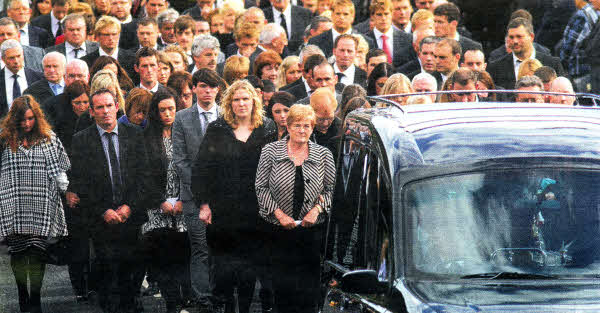 Family members at the head of the funeral cortege. Brian Little/ Presseye