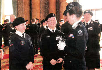 St John Ambulance Cadet Lois Halley (left) from the Lisburn Division of St John Ambulance and her fellow Cadet Chuer Zhang chat to HRH The Princes Royal at a recent reception at Buckingham Palace.