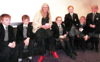 Cambridge Professor of Classics Mary Beard with pupils from St Patrick's Academy, Lisburn.