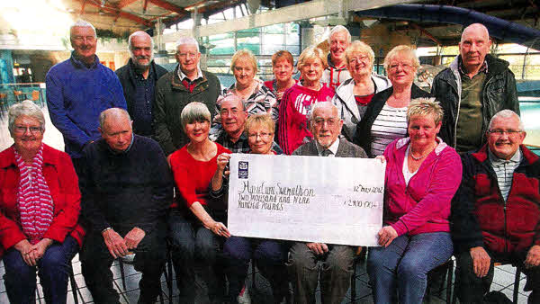 Nevin Mitchell and friends who took part in the recent Marie Curie Swimathon to raise £2,900 for charity. His wile died at Christmas from cancer and money was raised in her memory. US2012.113A0