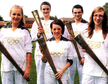 Evie Doman, Laurence and Philip Slater and Kiara Kennedy, pupils and teacher Victoria Walsh of Wallace High School who carried the Olympic Torch. US2412.101A0