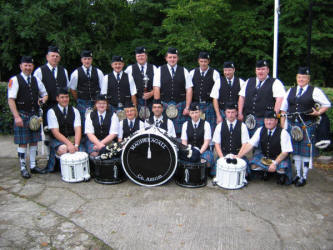 Pipe Major William Jackson (left) and Magheragall Pipe Band pictured at Lowquarter Orange Hall prior to the short walk to the District Service at Magheragall Parish Church last Sunday morning.  The immaculately turned out band won Best Overall Band at a Mini Twelfth Parade in Lurgan last Friday night.   