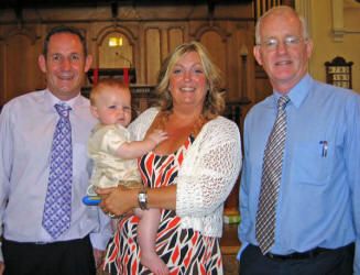 Paul and Adine McKeown pictured at the Dedication of their infant son Reece at a service in Railway Street Presbyterian Church last Sunday morning (30th July). Included in the picture is the Rev Brian Gibson who conducted the service.