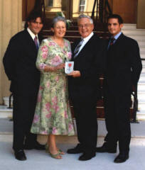 The Rev Dr Jack Richardson, who was awarded an MBE in the Queen's New Year's Honours List for services to the community in Northern Ireland is pictured after received his award from the Queen at an Investiture in Buckingham Palace on Wednesday 23rd May. Included in the photo are his wife Sally and two of their four sons Jeffrey and Neville.