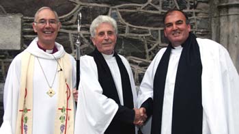 Rev Jim Martin (retired Rector of Mallusk) congratulates John McClure (right) who was Ordained in the Auxiliary Ministry for the Curacy of Skerry, Rathcavan and Newtownards at a service of Ordination. Looking on is the The Most Reverend Alan Harper - Archdeacon of Armagh.