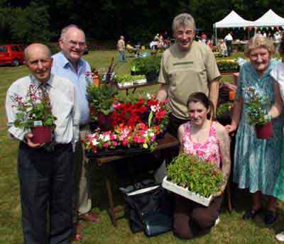 At the plant stand at the Garden Party at Kilwarlin Moravian Church last Saturday afternoon 9th June are L to R: Joe McCord, Derek Woods, Noel and Chelsea Walker and Amelia Megarry.