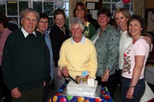 Mrs Marilyn Campbell is pictured cutting her cake last Friday night marking her retirement after almost 17 years of dedicated service to Charley Memorial Primary School.  L to R: Col Robin Charley, Sandra Thompson, Shirley MacWilliam, Anne Crooks, Gwen Forsythe (Principal), Lynda Graham and Mabel Quinn (all past and present members of the PTA).