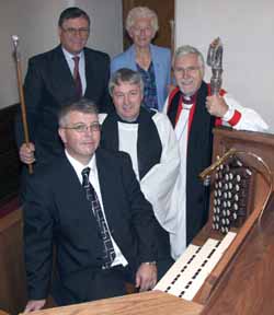 Pictured at a new organ which was dedicated during morning worship in Drumbeg Parish Church on Sunday 9th September are L to R: Ross Morrow - Organist, Rev Raymond Devenney - Rector and The Bishop of Down & Dromore, the Rt Revd Harold Miller. (back row) Roddy Oliver - Rector's Church Warden and Mrs Helen Smyth - People's Church Warden.