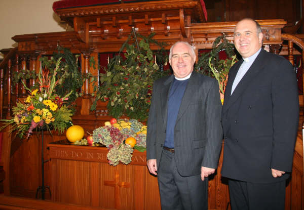 Pictured against tasteful floral decorations at the Harvest Thanksgiving Service in Seymour Street Methodist Church last Sunday morning are the minister, the Rev Brian Anderson (right) and the guest speaker, the Rev Aian Ferguson, President Designate of the Methodist Church in Ireland (left).