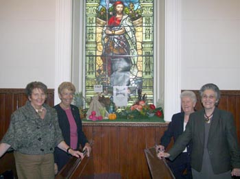 PWA members Margaret Rooney (Vice President), Inez Price, Vera McQuoid and Elizabeth Watt pictured at the PWA window, one of the many splendid floral decorations at the Harvest Thanksgiving Service in First Lisburn Presbyterian Church on Sunday 14th October.