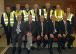 Reception committee and car park attendants pictured at a special service in Hillsborough Free Presbyterian Church last Tuesday (30th October) marking the retirement of the Rev Dr Stanley Barnes. L to R: (seated) Billy Foster, Trevor Hewitt, Robert Murphy, Eric Spence and George Reid. (back row) Ronnie Walker, Robert Porter, Richard Lockhart, Michael Coulter, Alex Graham, Trevor Malcolmson and Jimmy Murphy.