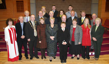 L to R: (front row) Patsy Douglas, Rev Clive Webster, Councillor James Tinsley (Mayor), Mrs Margaret Tinsley (Mayoress), Norma Bell MBE, Eddie Bell, Ryan Liggett (at front), Doreen Gregg, Cathryn Gibson and Jean Hazley. (back two rows) Councillor William Ward, Councillor William Leathem, Hayley Howe, Alderman Ivan Davis, Dougie King, Bronagh Mullan, Stephen McLoughlin, Arthur Scott, Stephen McIlwrath and Alderman Cecil Calvert.