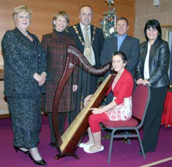 Claire Chapman (seated at the harp) pictured with her parents Gerald and Lorraine Chapman (right) and L to R: Norma Bell MBE, Mrs Margaret Tinsley (Mayoress) and Councillor James Tinsley (Mayor).