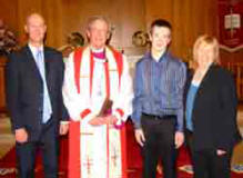 Joshua Colquhoun pictured with his parents at a confirmation service in St Paul's Parish on Sunday 4th March. Included in the picture is the Rt Revd S. G. Poyntz - former Bishop of Connor.