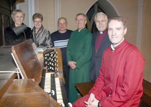 Phillip Elliott (right) pictured after playing in the New Year on the three-manual Snetzler organ.