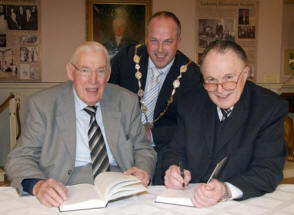The Rev Dr John Douglas signs a copy of his book entitled �Psalm 119 - The Complete and full-orbed alphabet of Heaven� for the Rt Hon Dr Ian Paisley. Looking on is Lisburn Mayor, Councillor James Tinsley, who launched the book on Saturday 1st March, in the Assembly Room of the Linen Centre, Lisburn.