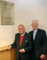 The Very Rev Dr Howard Cromie pictured unveiling a brass plaque commemorating the re-dedication of Railway Street Presbyterian Church. Looking on is the minister, the Rev Brian Gibson.