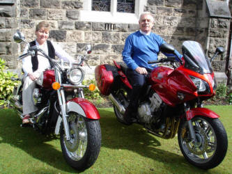 Revd Charles McCartney and his wife Cecilia pictured on their motorcycles.